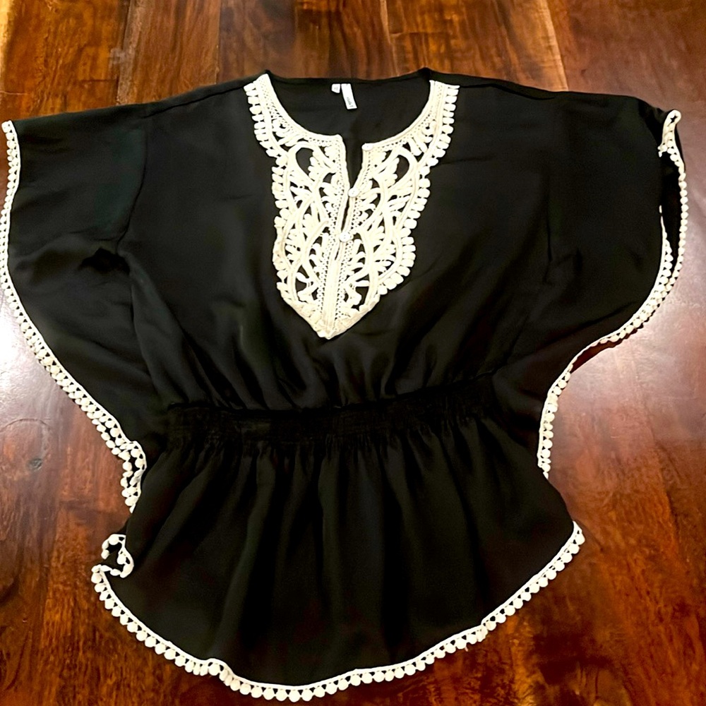 Black and with white detail bat wing blouse